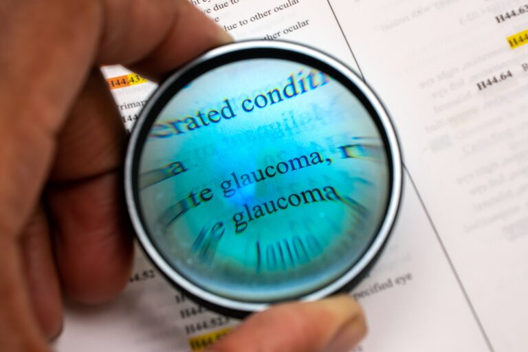 African American man using magnifying glass to look at word glaucoma Boerne Vision Center African American man using magnifying glass to look at word glaucoma