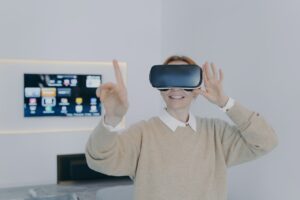 Young woman in 3d goggles in office. Futuristic technology and contemporary education.